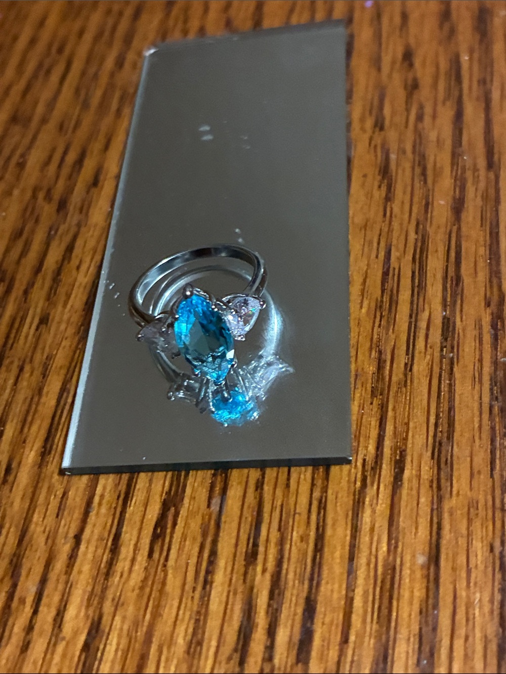 Blue Oval Gemstone Ring with Side Accents